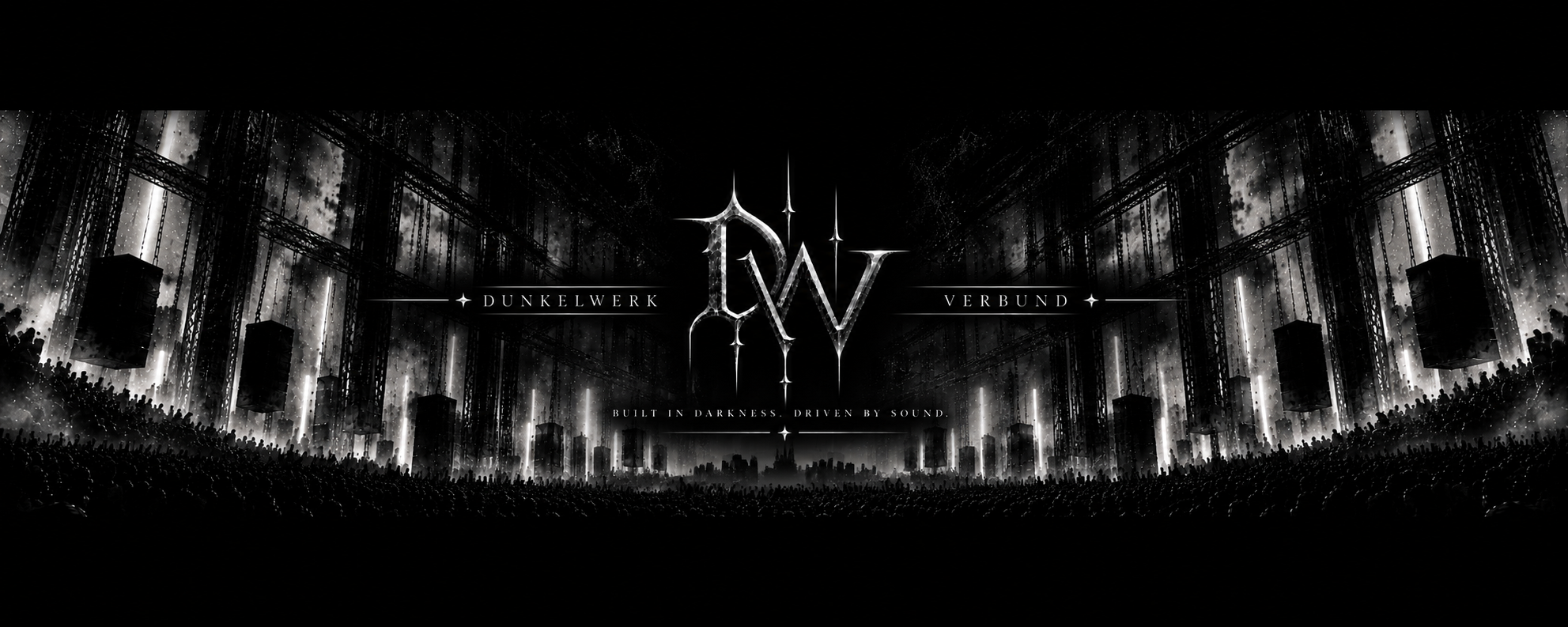 Dunkelwerk Verbund silver emblem in a vast industrial concert hall